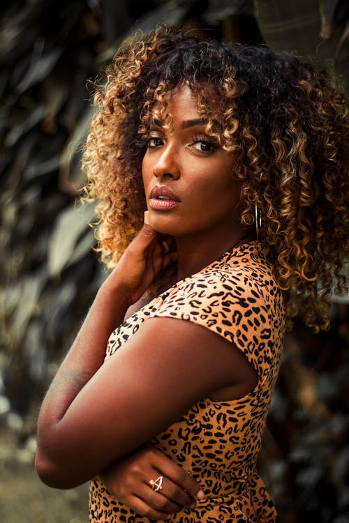 A Woman in Brown and Black Leopard Print Tank Top