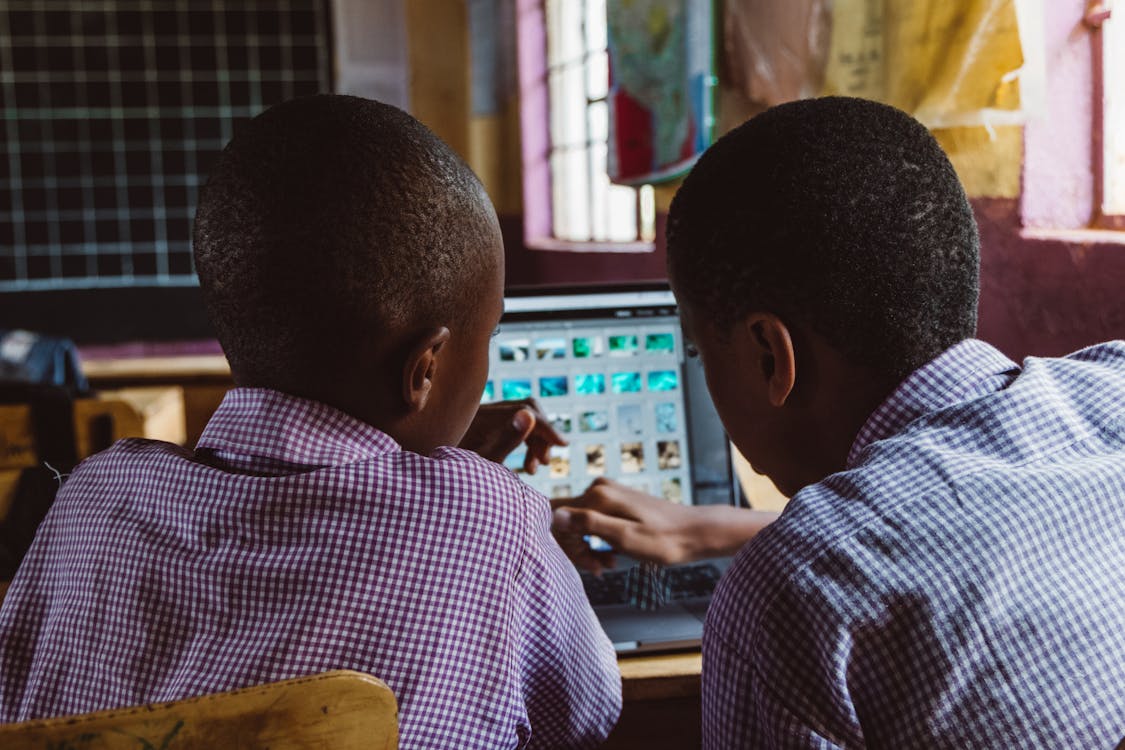 Two Boys Using a Laptop