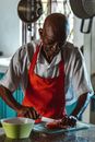 Man in White Button Up T-shirt and Red Apron