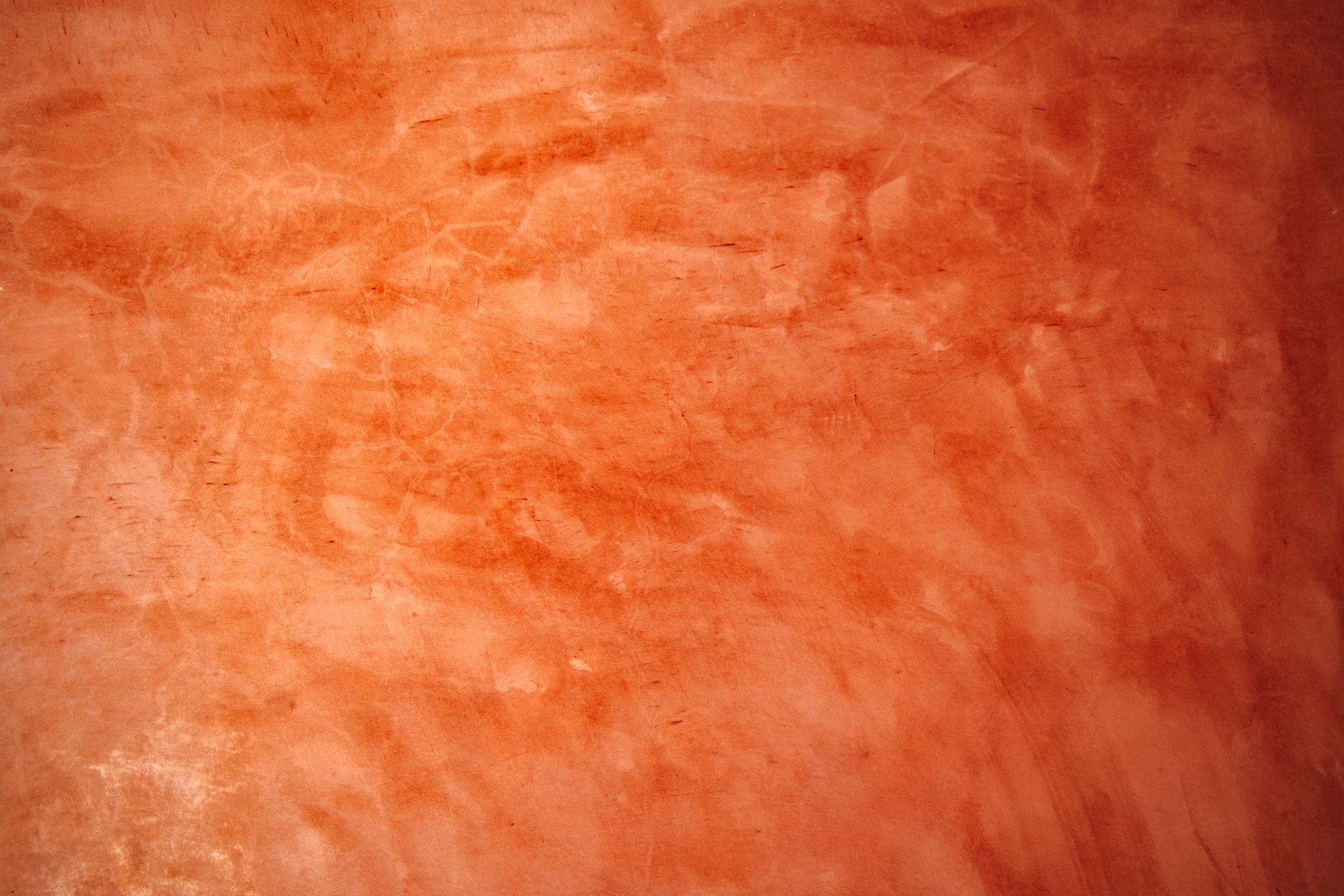 Abstract orange wall texture perfect for backgrounds and artistic projects.