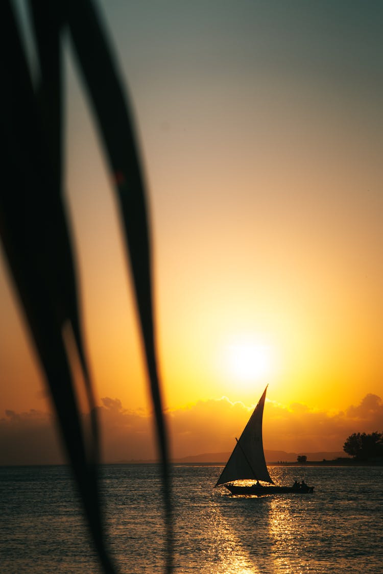 A Boat Sailing During Sunset