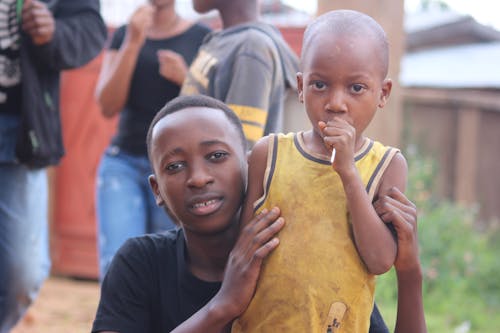 Free Man And Boy Wearing Black And Yellow Shirts Stock Photo