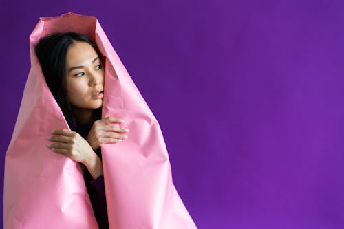 A Woman in Covered with Pink Paper