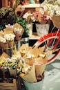 Colourful Bouquets Wrapped in Beige Paper in Flower Shop