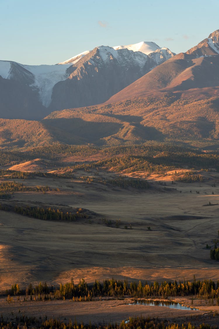 Brown And White Mountains Under White Clouds