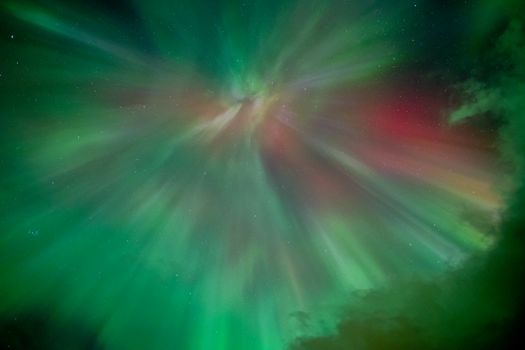 Aurora Borealis displays vibrant colors and dynamic patterns over Norway's night sky.