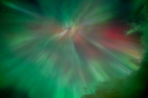 Free Aurora Borealis displays vibrant colors and dynamic patterns over Norway's night sky. Stock Photo