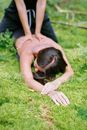Woman in Black Shirt Lying on Green Grass