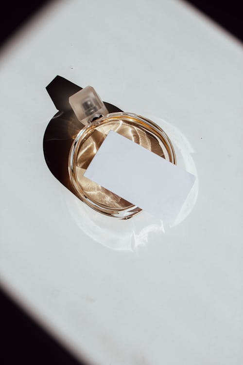 Free A Blank Business Card on a Perfume Bottle Stock Photo