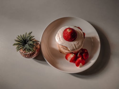 A Stack of Pancakes With Strawberries