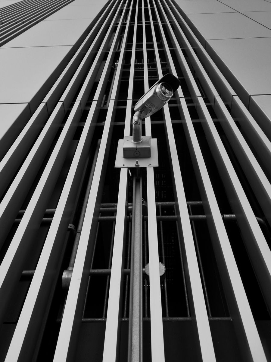 Surveillance camera on modern building facade