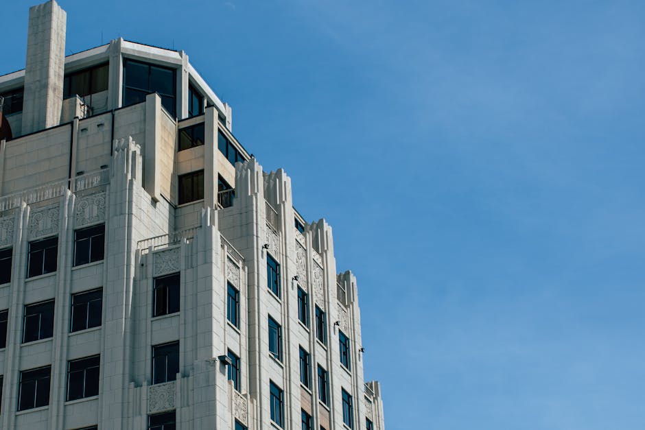 Grey Concrete Round High Rise Building · Free Stock Photo