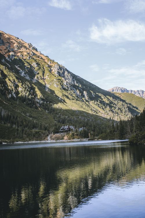 Free Breathtaking view of a serene mountain lake and lush greenery in Zakopane, Poland. Stock Photo