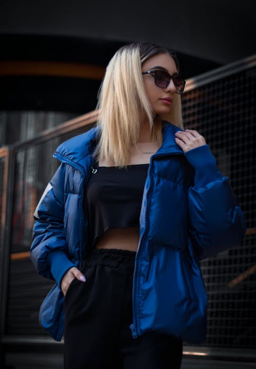 A Woman in Blue Jacket Wearing Black Sunglasses