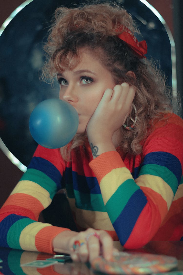 Young Woman Chewing A Bubble Gum 