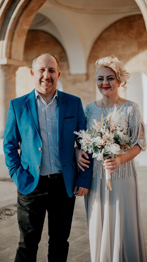 A Man in Blue Suit and a Woman in Gray Dress