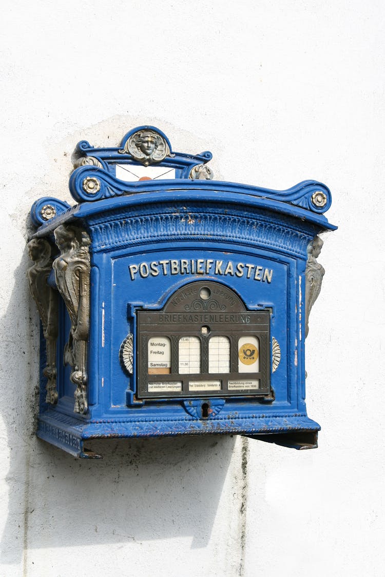 Blue Mailbox On The White Wall