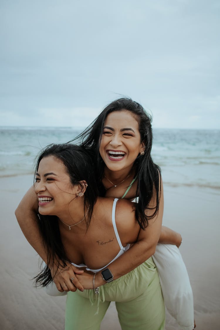 Twin Sisters On The Sandy Shore Of A Beach