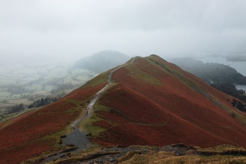 Free Explore the misty paths of Cat Bells overlooking the serene landscapes of Cumbria, England. Stock Photo