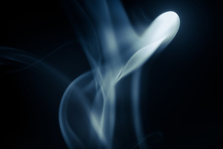 White And Blue Smoke With Black Background
