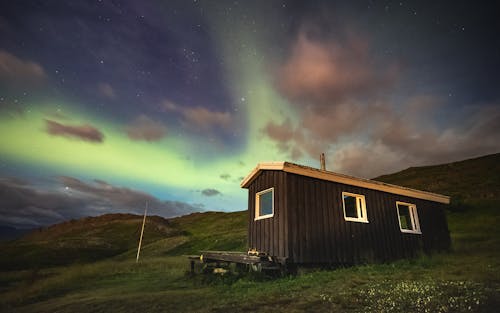 Brown Wooden House Under the Starry Sky 