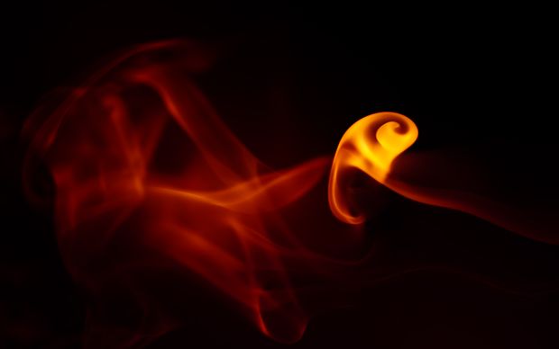 Curling red smoke on black, photo by Marek Piwnicki on Pexels