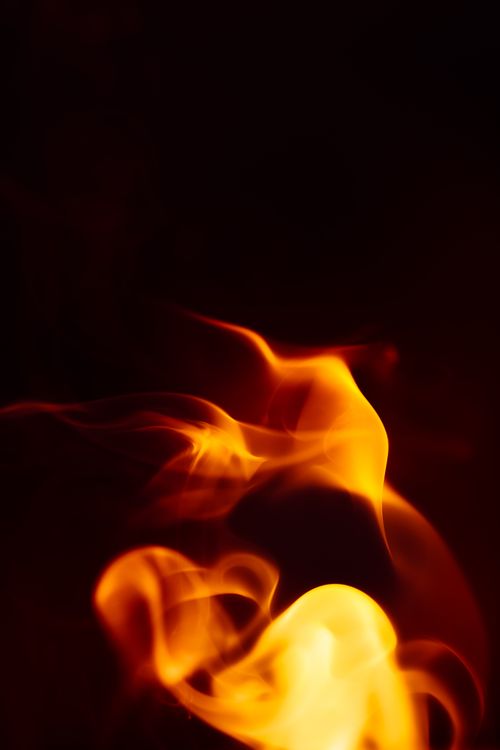 Free Abstract image capturing vibrant flames against a dark background. Stock Photo