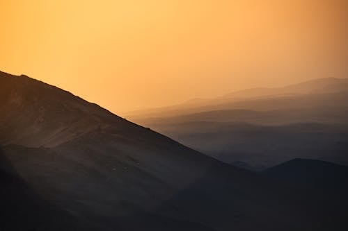 Brown Mountain Under Blue Sky