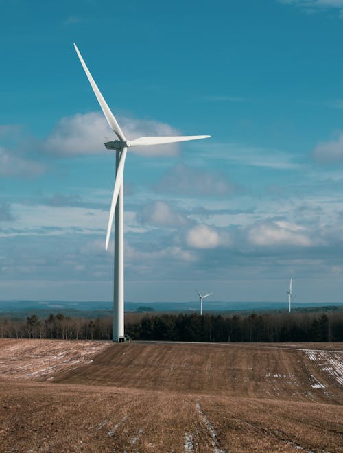 Free Wind Turbine on the Farm Field Stock Photo