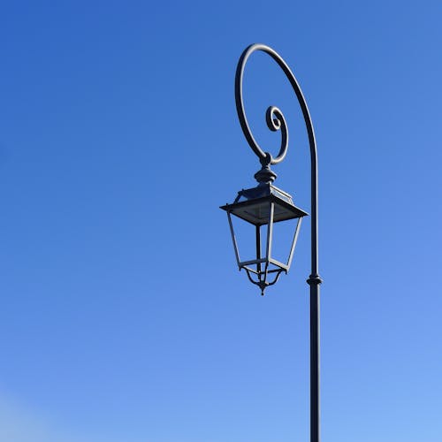 A Black Street Lamp Under the Blue Sky