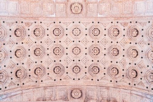 Free Close-up of an intricate ornamented ceiling with geometric patterns viewed from directly below. Stock Photo
