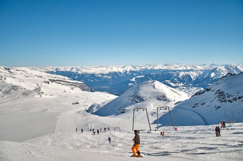 Free People Skiing on Mountain Hill Stock Photo