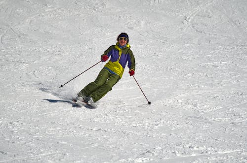 A Man Skiing Down the Ski Slope