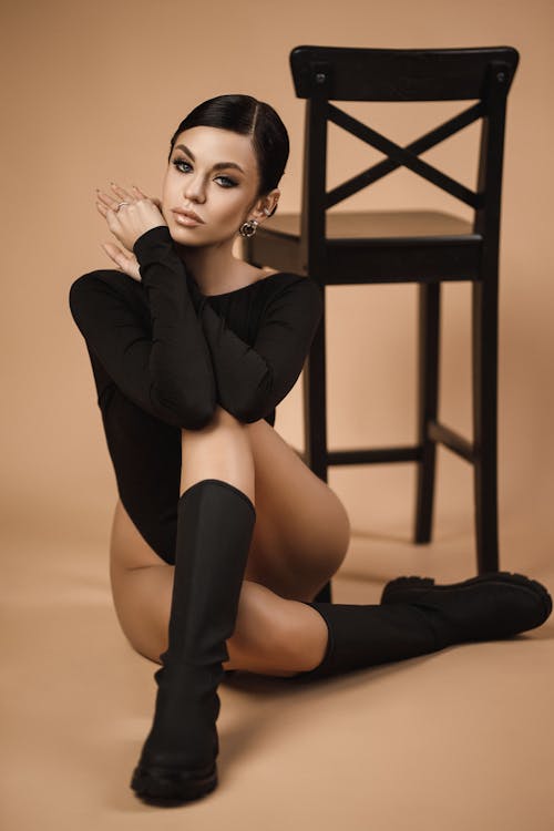 Free Young Brunette Woman Wearing Black Long Sleeved Body and Boots  Stock Photo