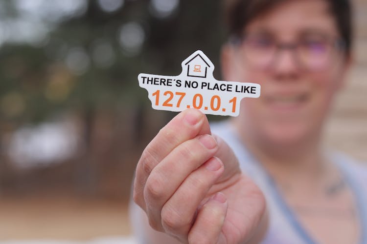 Person Holding Logo Of There Is No Place Like Home