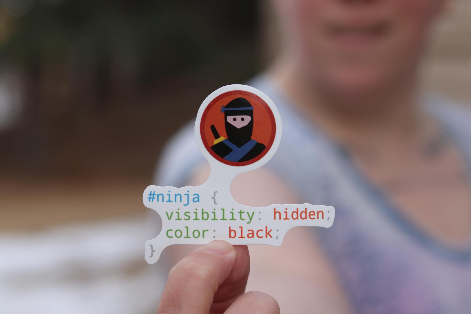 Close-up Shot of a Person Holding a Sticker