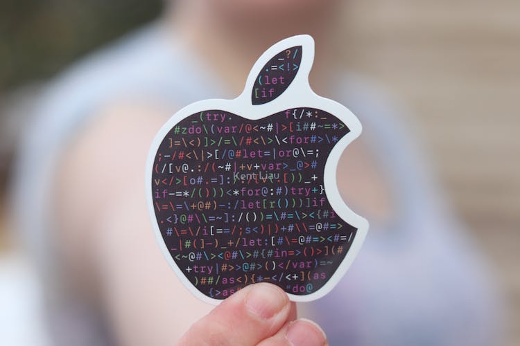 A Person Holding A Black Sticker