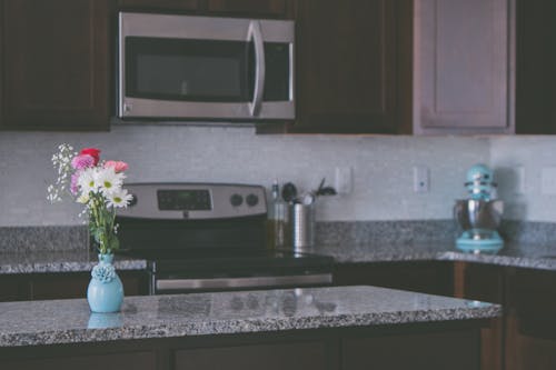 Flowers On Vase On A Kitchen Counter
