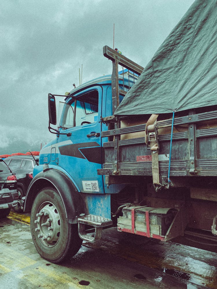 Old Delivery Truck On A Traffic Jam On Street Close-Up Photo