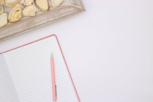 Free Red Pen on White Paper Stock Photo