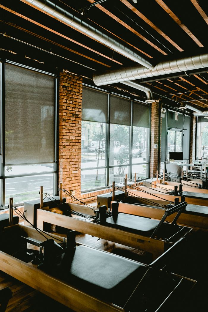 Spacious pilates room with equipment — photo by Karl Solano on Pexels