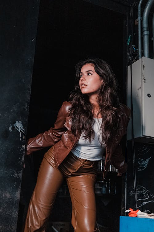 Woman in Leather Suit Posing