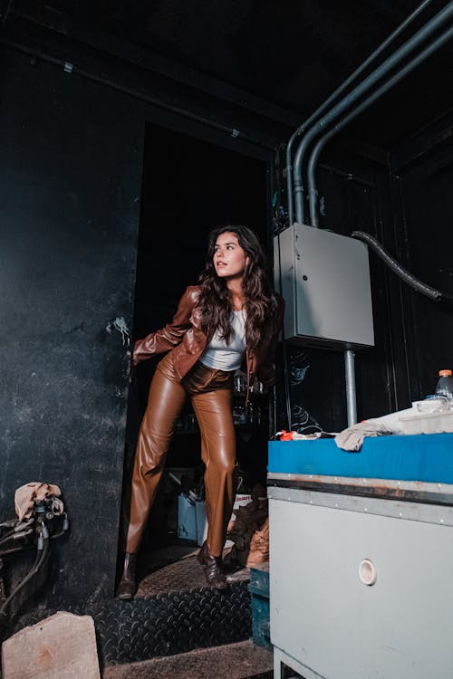 Woman in Brown Leather Jacket and Brown Leather Pants