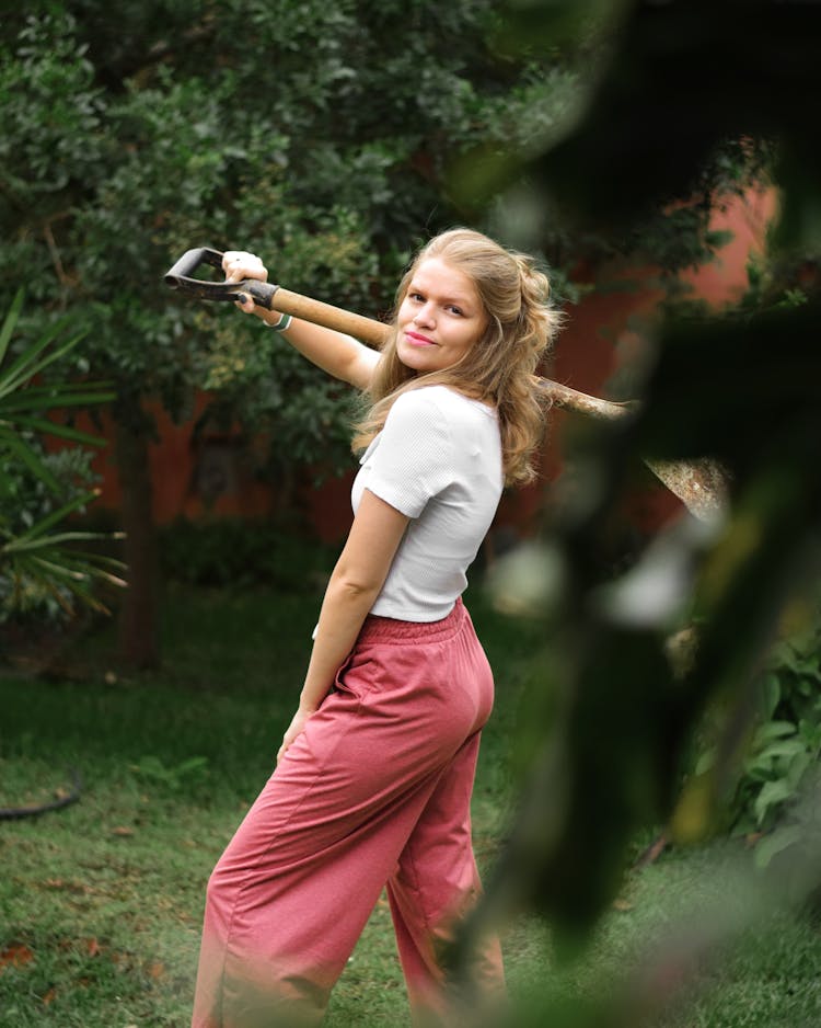 A Woman Holding A Shovel