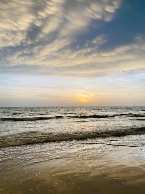 Ocean Waves Crashing on Shore during Sunset