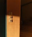 White Light Switch on Brown Wooden Wall