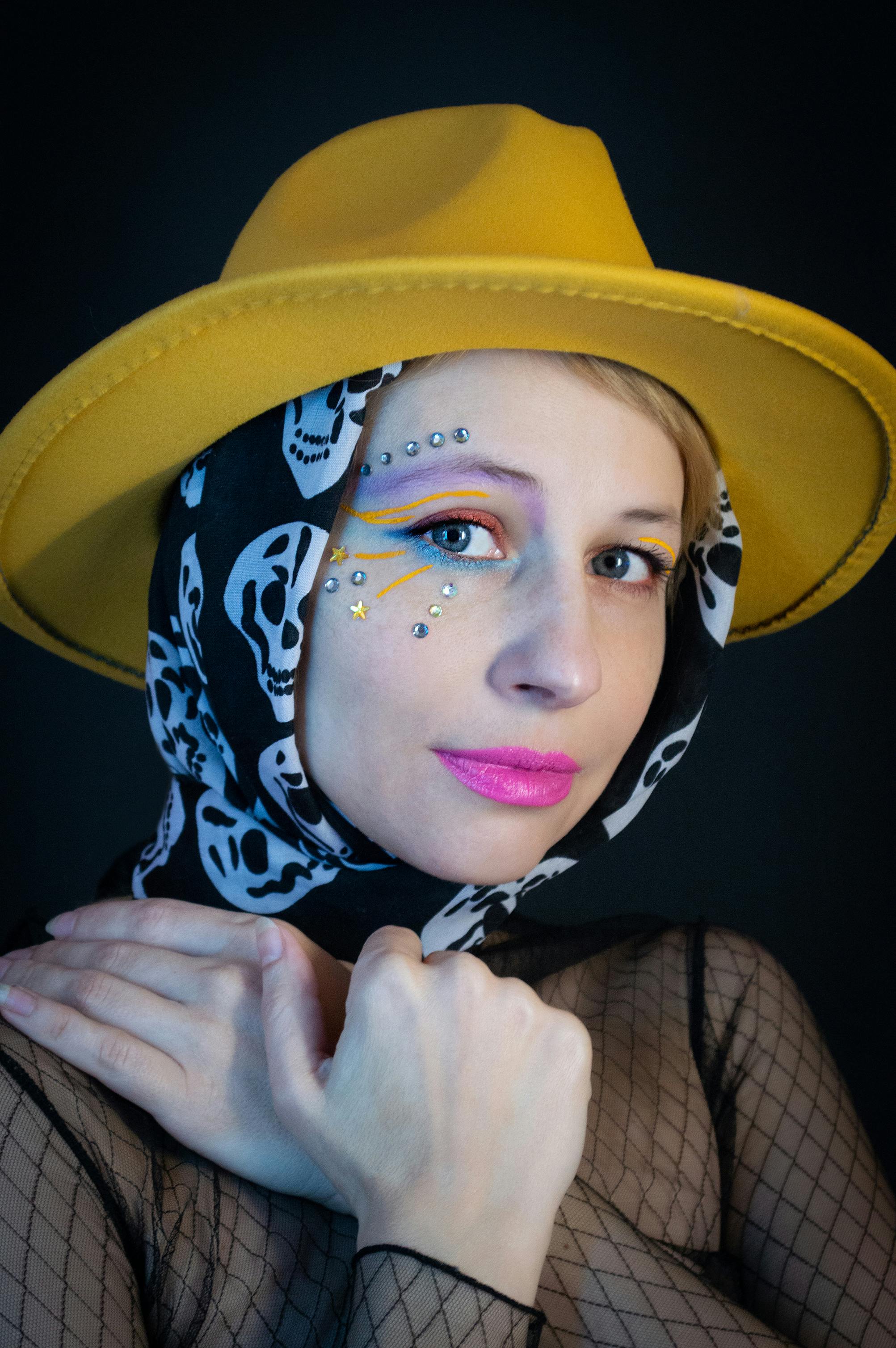 a-woman-in-white-see-through-clothes-with-her-hand-on-her-head-free-stock-photo