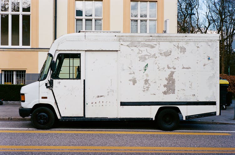 White Delivery Van Parked On Roadside