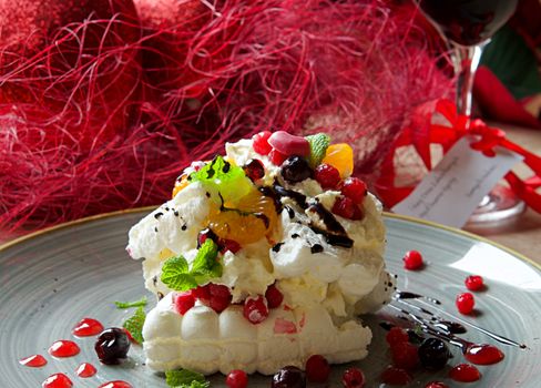 Indulge in a decadent dessert adorned with fresh berries and vibrant toppings on a stylish plate.