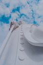 Low Angle Shot of White Concrete Statue Under Cloudy Sky